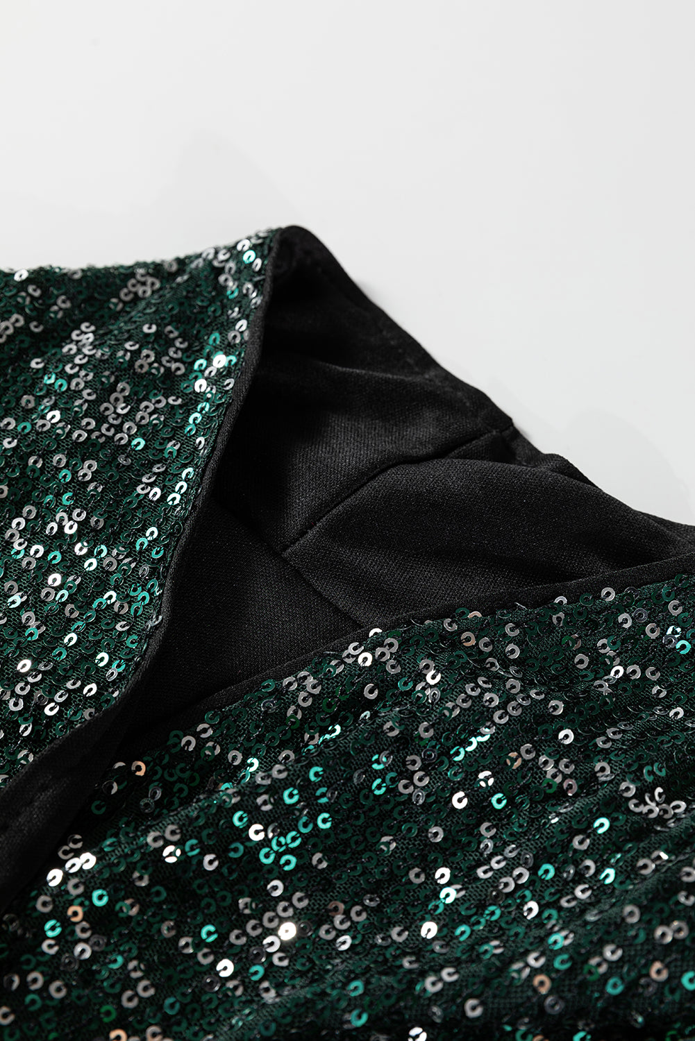 Top blazer à sequins vert sapin — col V ouvert, manches longues