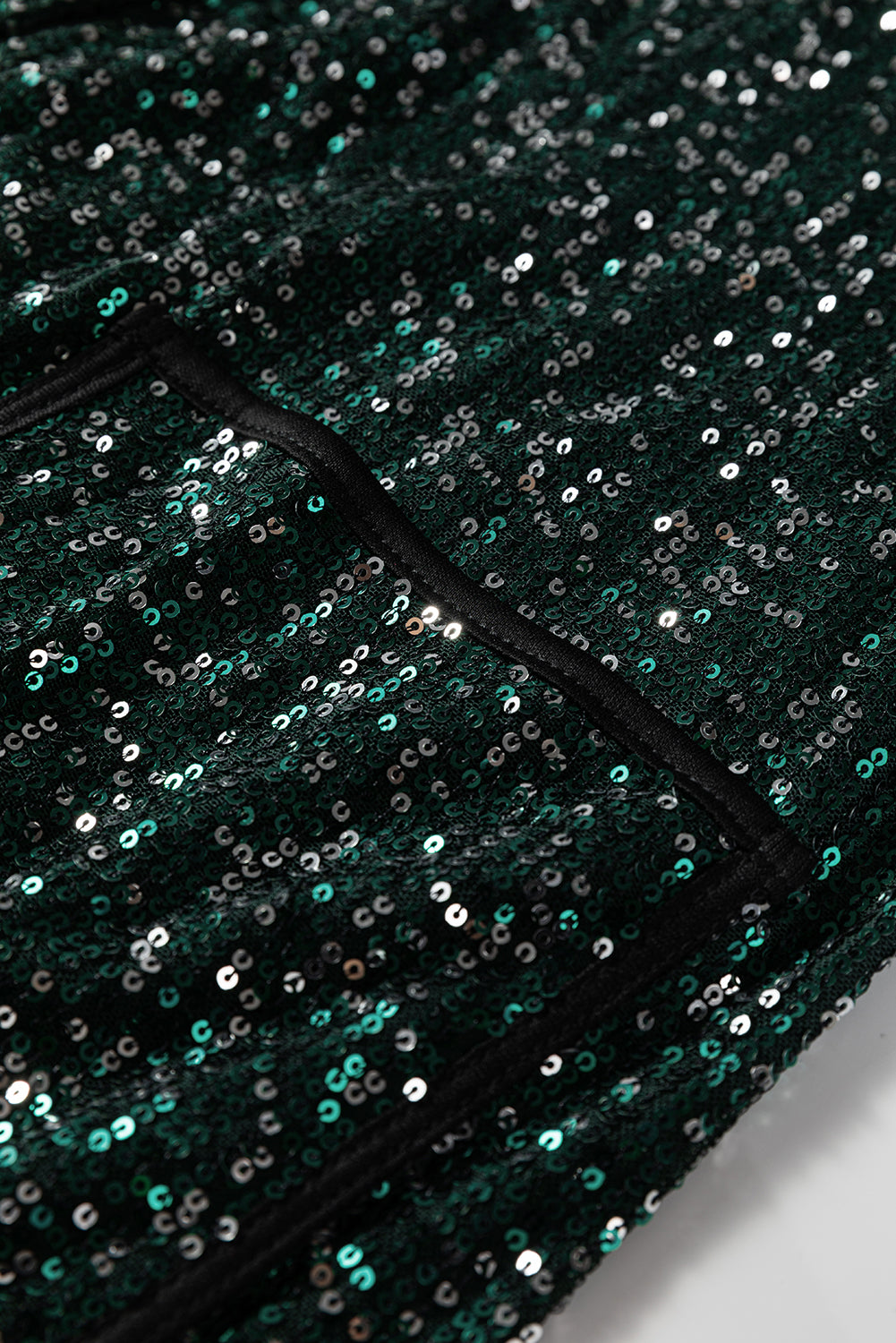 Top blazer à sequins vert sapin — col V ouvert, manches longues