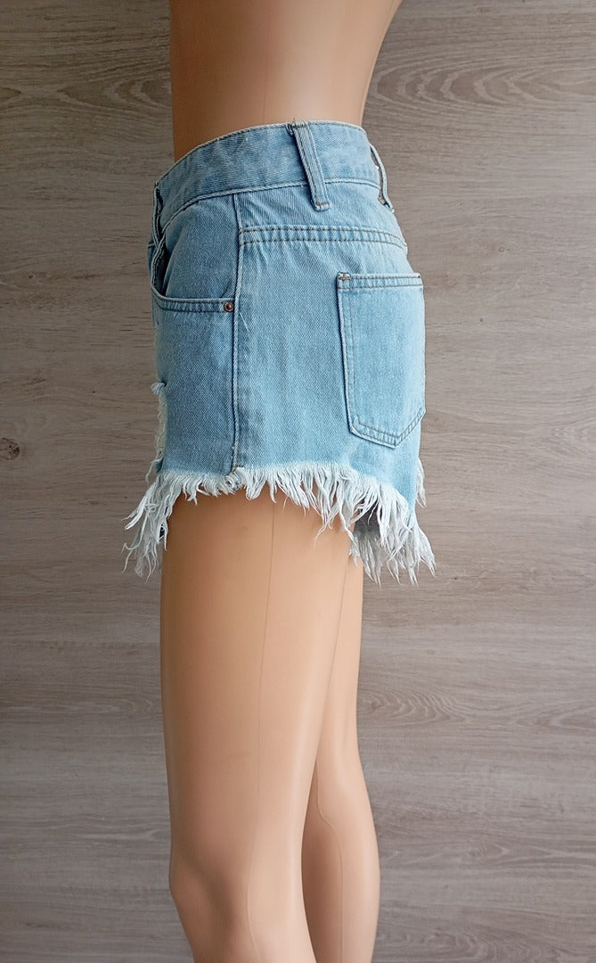 Shorts court fille femme en jeans bleu clair avec clous Xs très bon état avec franges