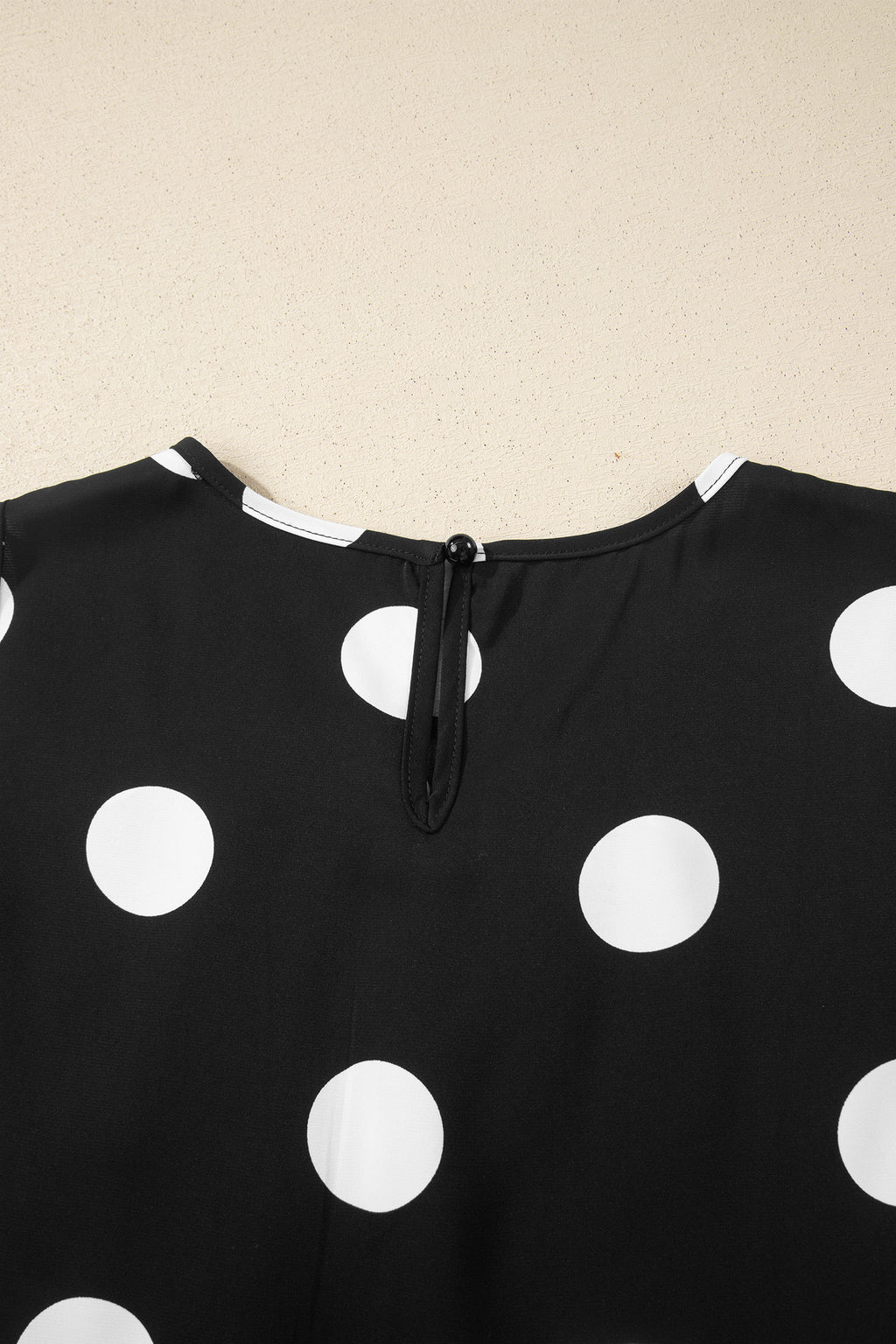 Ensemble deux pièces à pois noirs — débardeur plissé col rond et pantalon jambes larges