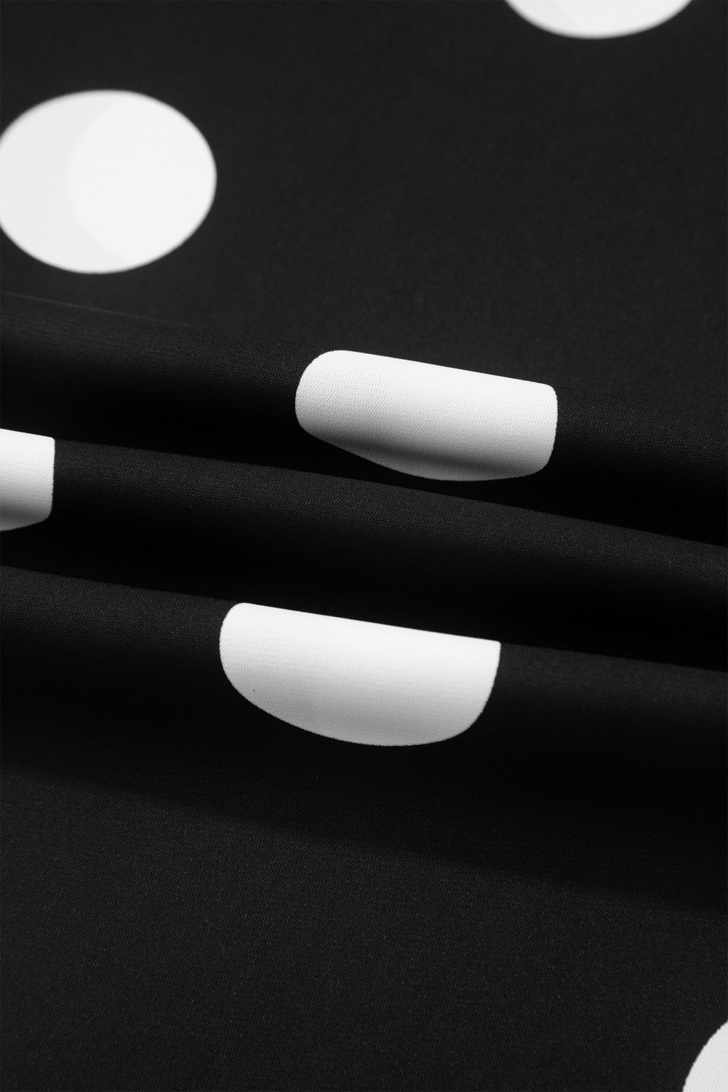 Ensemble deux pièces à pois noirs — débardeur plissé col rond et pantalon jambes larges