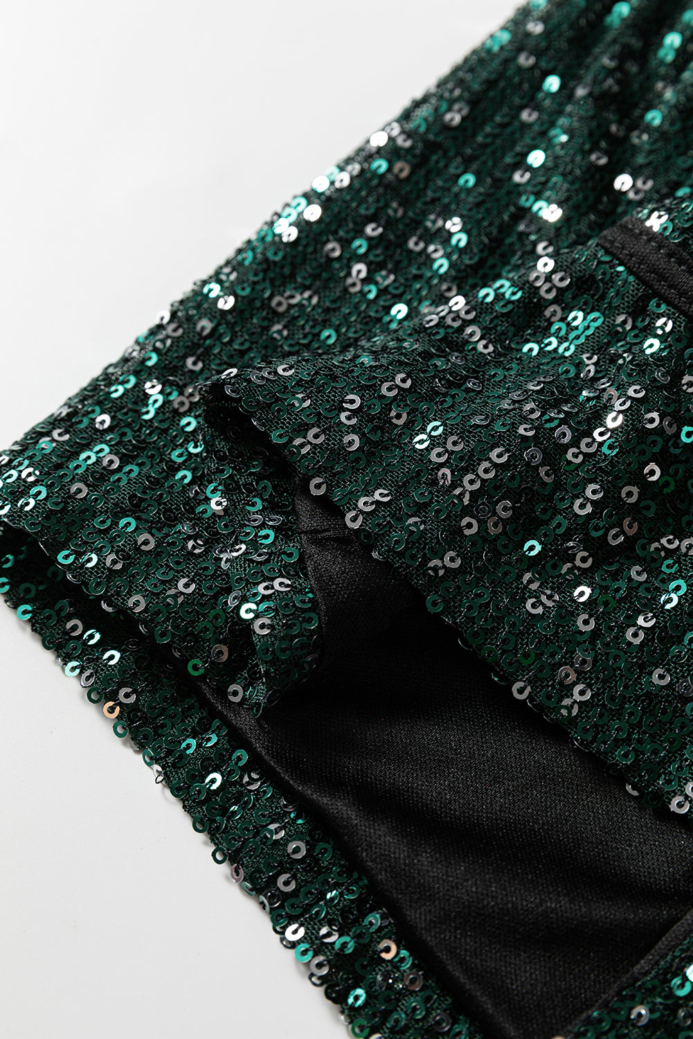 Top blazer à sequins vert sapin — col V ouvert, manches longues