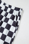 Pantalon large à carreaux noir — taille haute et jambes fluides