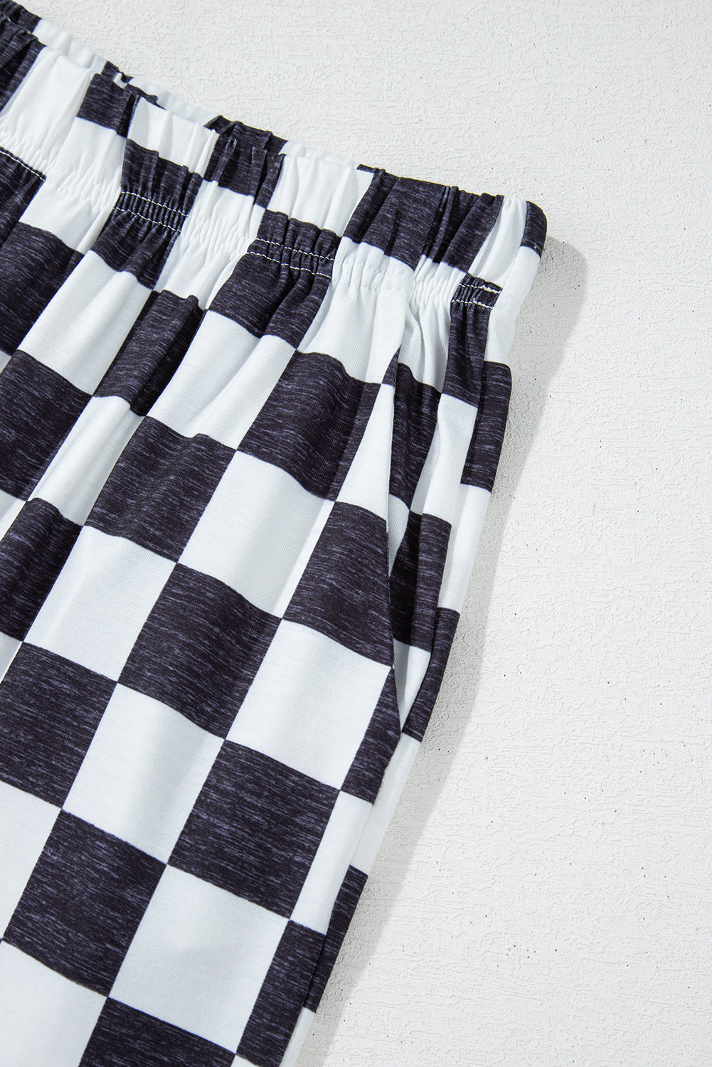 Pantalon large à carreaux noir — taille haute et jambes fluides